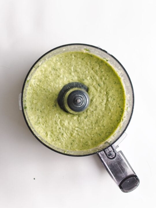 green goddess hummus blended in food processor